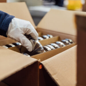 An employee checks dental disks in the Titanium Solutions warehouse.