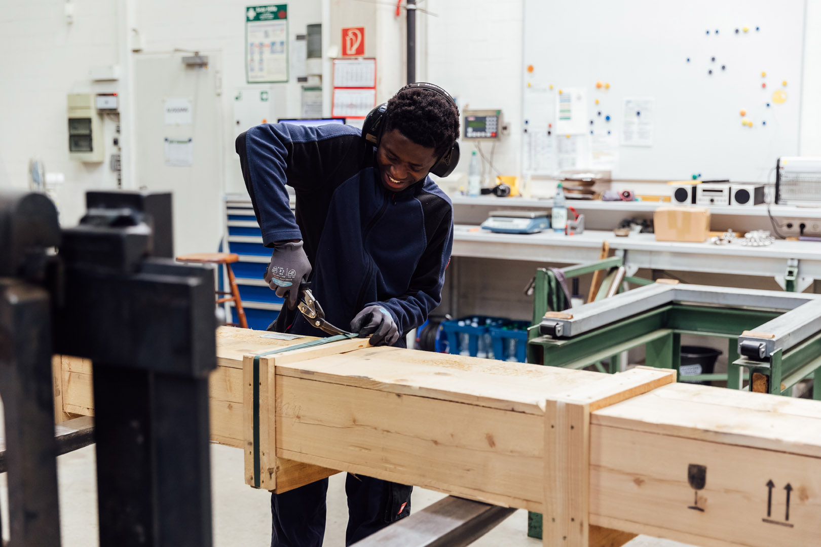 An employee packing titanium rods.